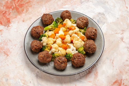 Preview: front view broccoli and cauliflower salad and meatball on plate on nude isolated background
