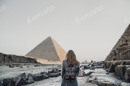 Preview: A European blonde walks near the pyramids in the desert in Cairo