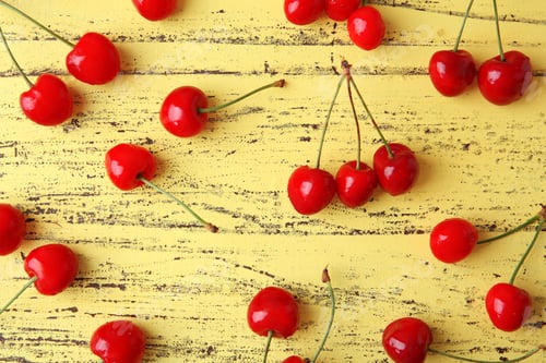 Preview: Ripe red cherries on wooden background, top view