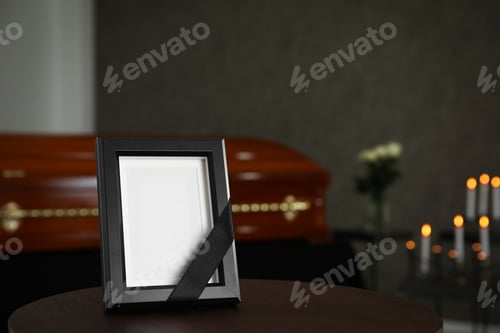 Preview: Black photo frame on table in funeral home