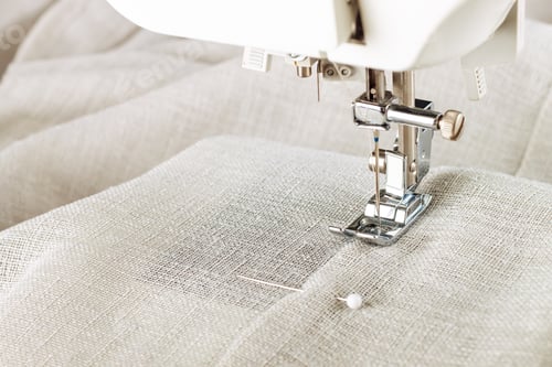 Preview: Modern sewing machine presser foot and item of clothes. Sewing process, handmade, hobby, business