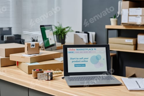 Preview: Workplace of volunteer with homepage of online marketplace on laptop screen