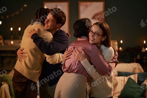 Preview: Multiethnic Young Adults Hugging Each Other during Warm Friendly Gathering
