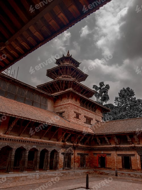 Preview: Vertical shot of the historic Krishna Temple on a gloomy day in Mandir, Nepal