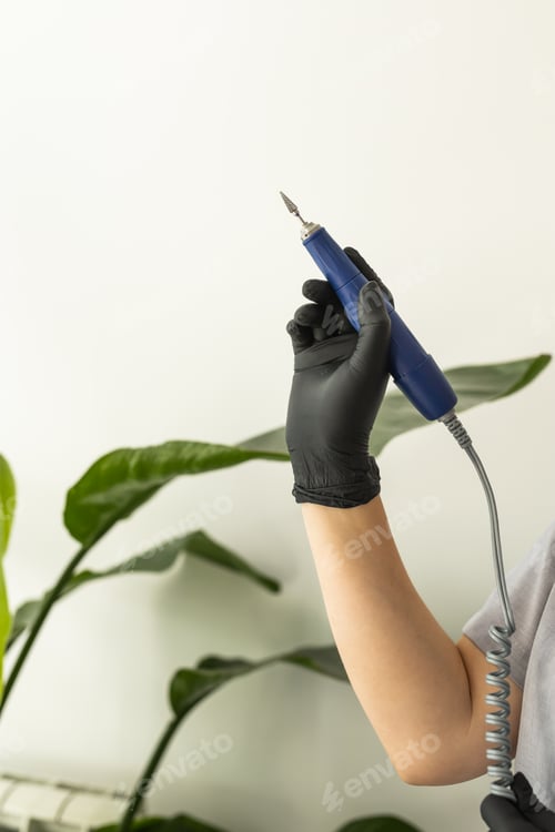 Preview: Electric nail file drill manicure machine with fraser close up on light background with copy space