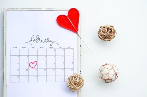 Preview: February 2023. Calendar flat lay.
