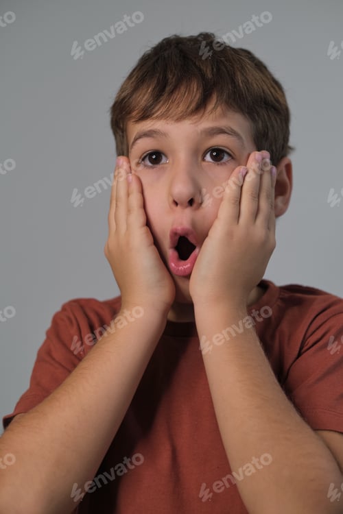 Preview: Child s expression of mock terror, eyes widened, mouth open, captures a moment of fun. Highlights