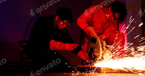 Preview: Male welders working together at site.