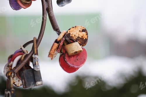 Preview: close up old rusty locks heart shaped on wire rope. Love lock on the bridge. tradition of hanging a