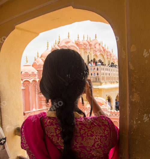 Preview: Woman in Hawa Mahal and enjoying holiday at Jaipur, Rajasthan, India.
