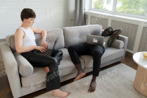 Preview: Young couple watching laptop