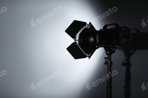 Preview: Professional photo studio lighting equipment on dark background. Space for text