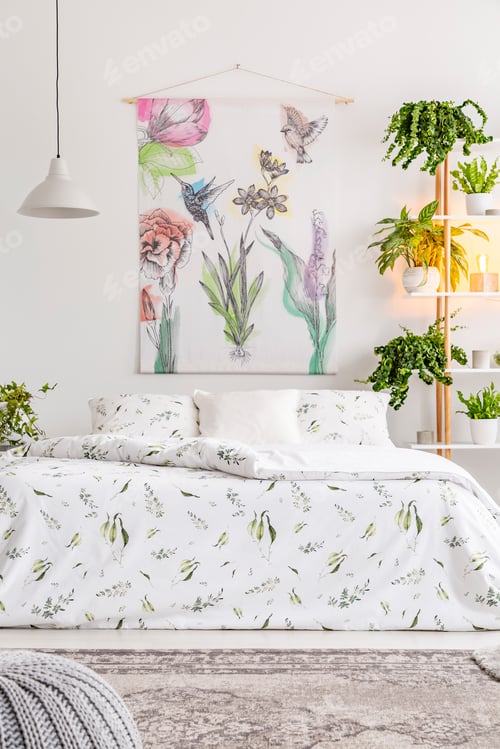 Preview: Natural bright bedroom interior with a comfortable bed dressed i