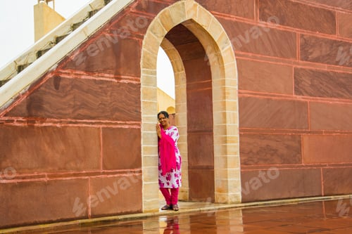 Preview: Woman tourist at the Jantar Mantar observatory, Jaipur, UNESCO World Heritage Site, India.
