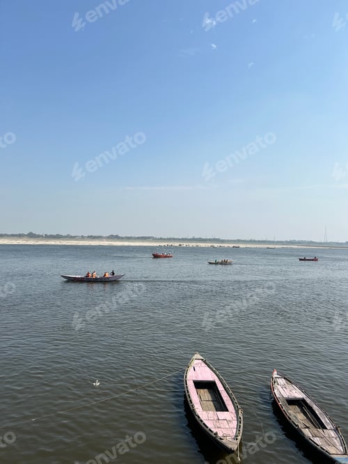 Preview: Boats docked closely together in calm water