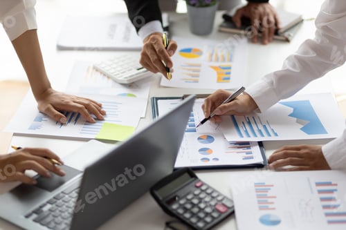 Preview: Business people analyzing chart, financial report and market growth plan business strategies.