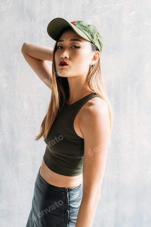 Preview: young woman indoors posing looking camera