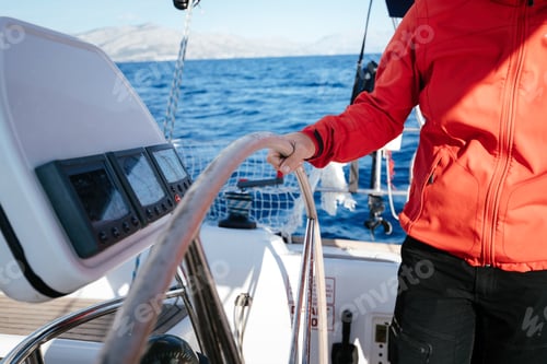 Preview: Attractive strong woman sailing with her boat