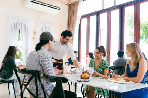 Preview: Waitress man serving food to group of diverse customer in restaurant, eatery client woman