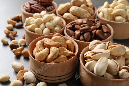 Preview: Bowls with organic nuts on table. Snack mix