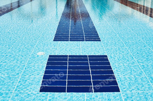Preview: Background of water in blue swimming pool, water surface with a sun reflection