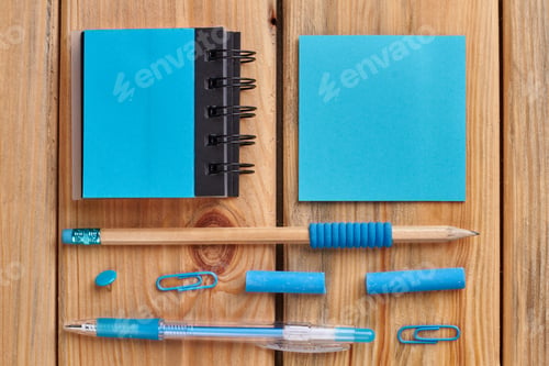 Preview: Wooden background with school accessories.