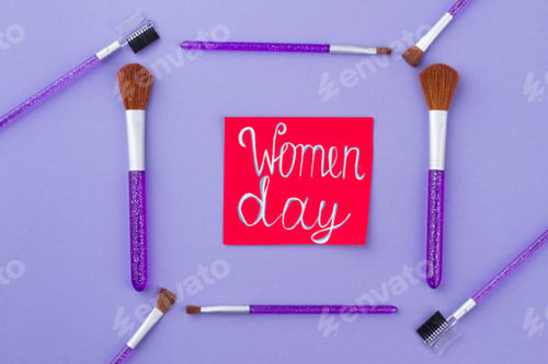 Preview: Women day written on a red paper.