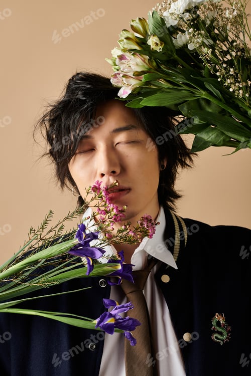 Preview: Spring fashion inspiration featuring a stylish Asian man in a studio with floral accents