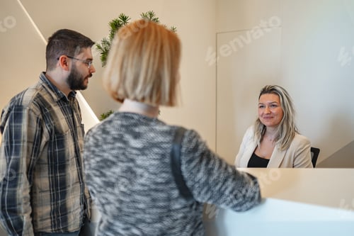 Preview: Woman Speaking to Man in Front of Mirror