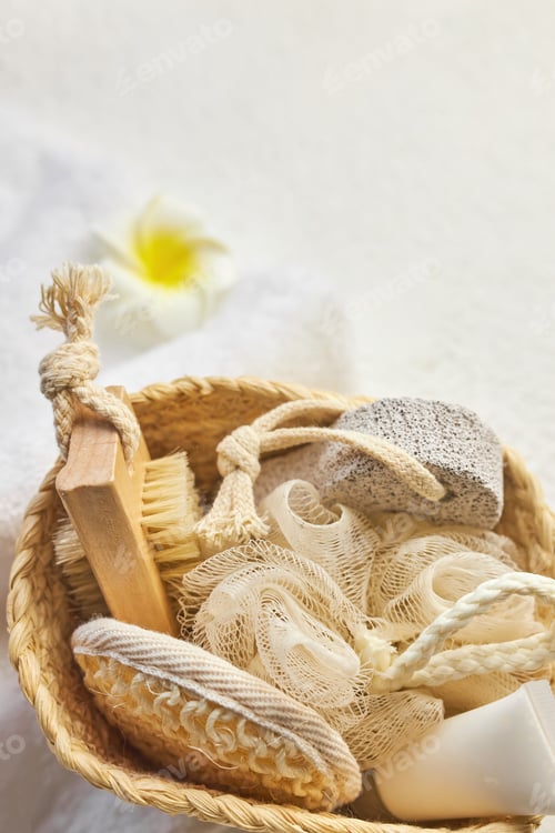 Preview: Wicker basket with set of cosmetic bottles, tubes, jars, brushes.