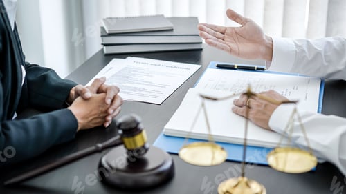 Preview: Businessman is bringing the legal document for consultation with female lawyer and she is explaining