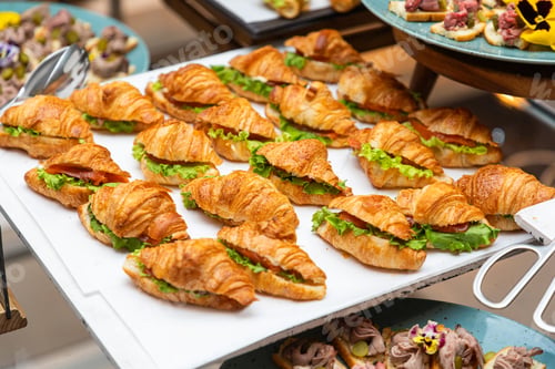 Preview: Mini croissant sandwiches with lettuce on display tray