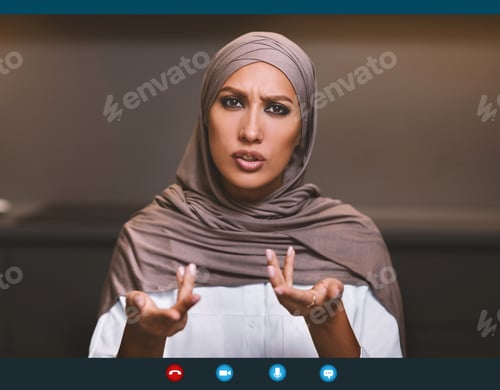 Preview: Serious Arab Lady Talking To Camera Making Video Call Indoor