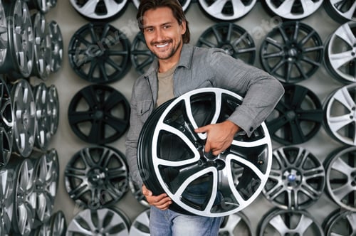 Preview: Big choice. Man is in the tire fitting car service
