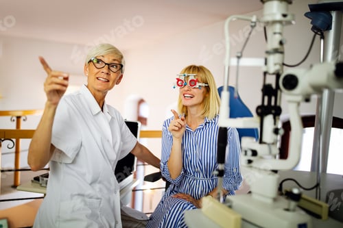 Preview: Optometrist examining patient in modern ophthalmology clinic