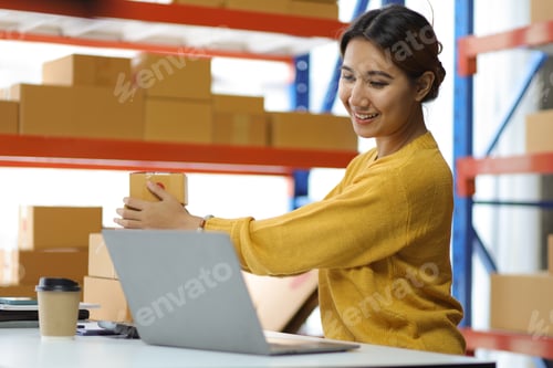 Preview: Woman who start up small business works in a warehouse.