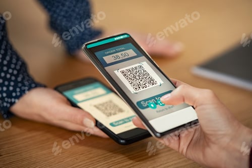 Preview: Woman scanning qr code for mobile payment