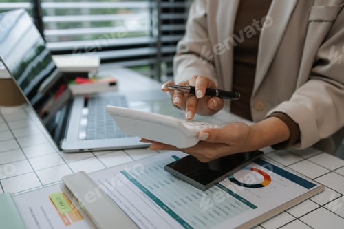 Preview: a businesswoman is using an electronic device to search and send information to her team