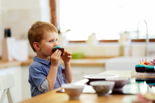 Preview: Cute child tasting cookies