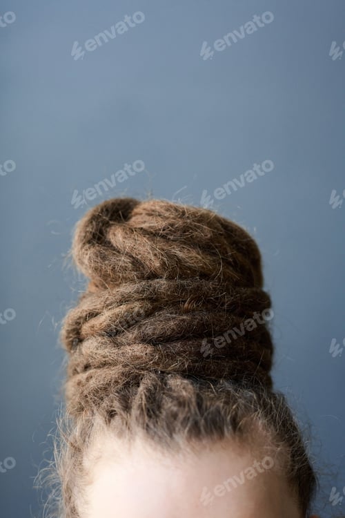 Preview: Unrecognizable Person with Dread Bun Hairstyle