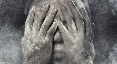 Vista previa: Man with hands on his face covered by the dust