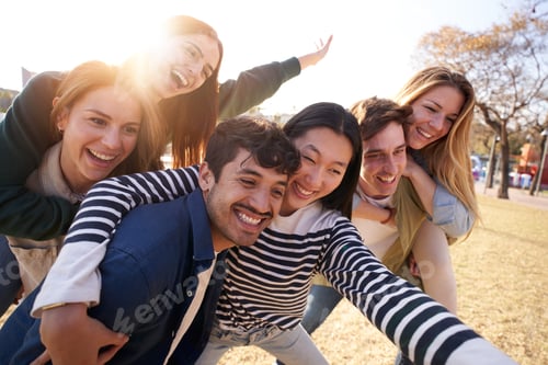 Preview: a group of young people are posing for a picture in a park