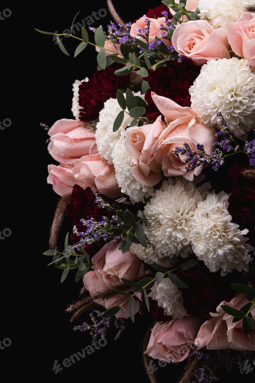 Preview: Vertical closeup shot of a luxurious bouquet of pink roses and white flowers on a black background