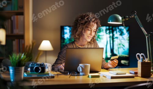 Preview: Woman doing online shopping and using a credit card