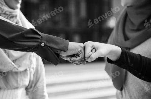 Preview: Islamic women friends fist bumps
