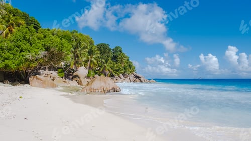 Preview: Anse Patates beach, La Digue Island, Seyshelles, white beach with blue ocean and palm trees