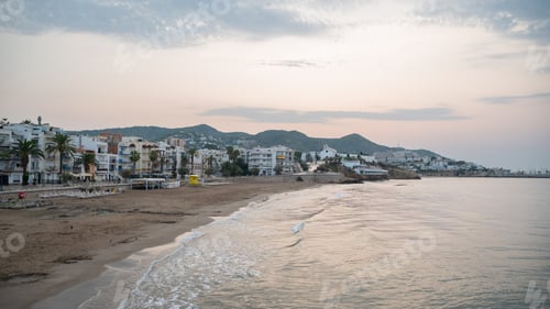 Preview: Sunrise illuminating the coast of Sitges, Spain