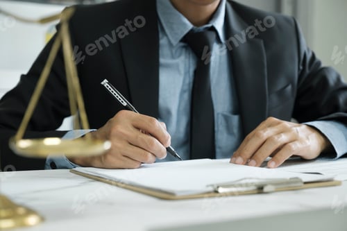 Preview: Male lawyer in the office with brass scale.