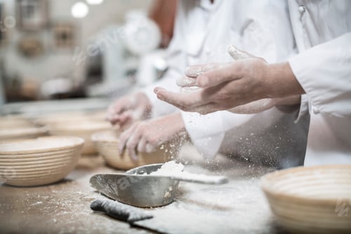 Preview: Baker preparing ceramic bowls for baking bread