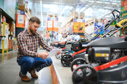 Preview: a customer in a hardware store chooses a gas or electric lawn mower